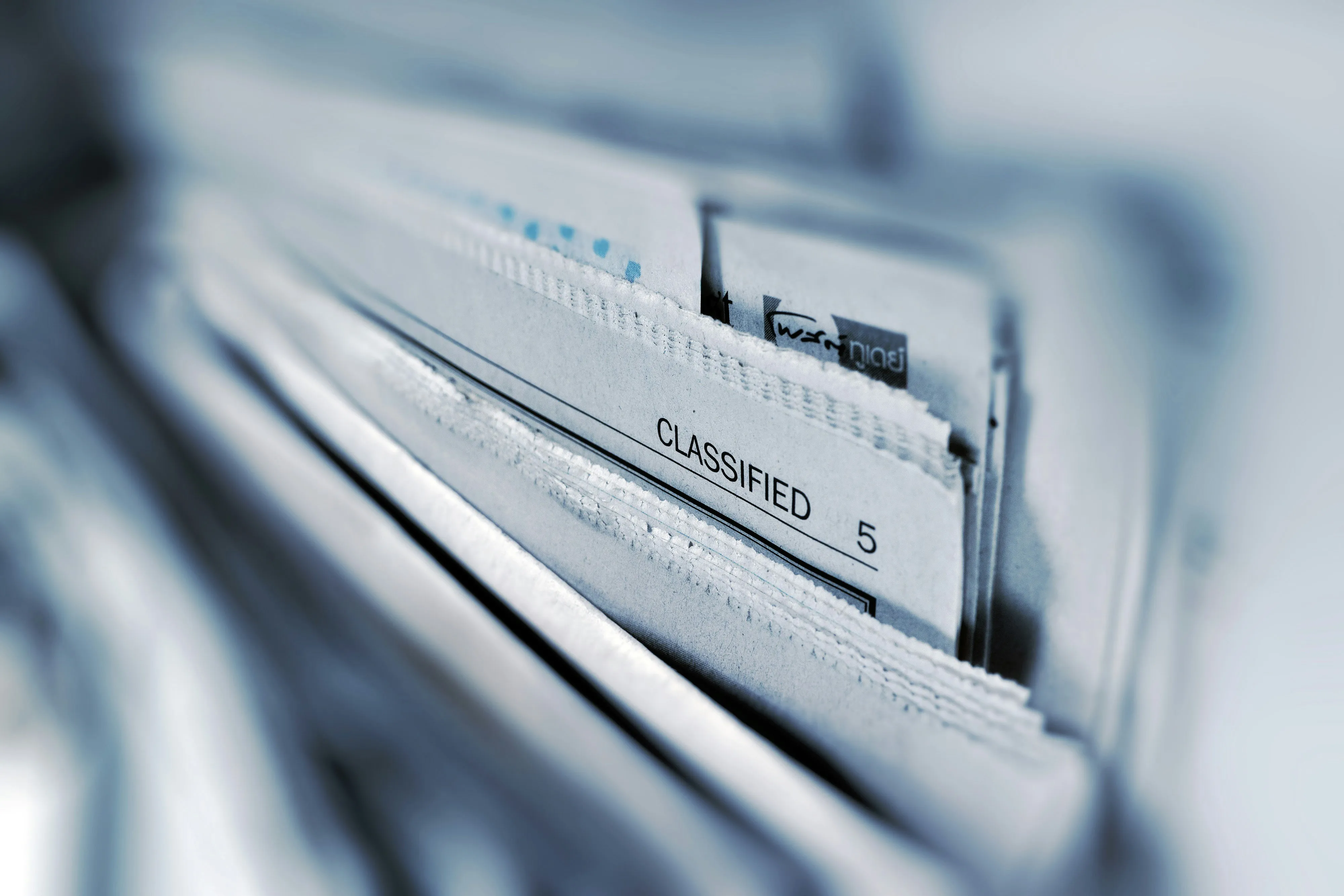 document cabinet with a document labeled as 'Classified'